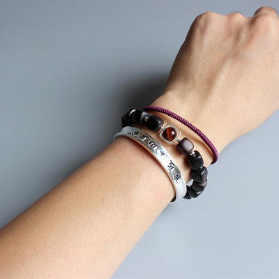 - Armband-Handarbeit in Der "Herz-Sutra" der Prajna Paramita